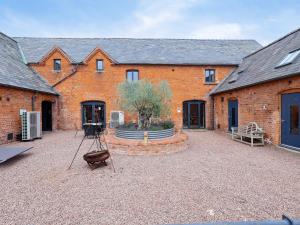 a camera on a tripod in front of a brick building at Plough Share in Gloucester
