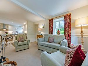 a living room with two couches and a kitchen at Fox Cover - Uk49892 in Preston