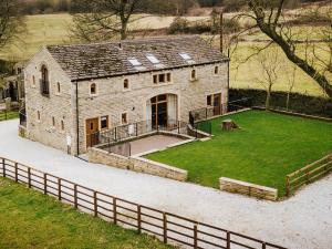 an old stone house with a large yard at Sycamore Barn - Uk33353 in Buttershaw