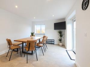 a dining room with a table and chairs at Chancery View in Ross on Wye