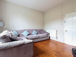 a living room with a couch and wooden floors at Brook House - Uk43013 in Berkeley