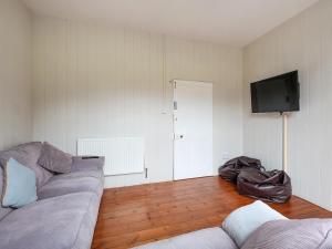 a living room with a couch and a flat screen tv at Brook House - Uk43013 in Berkeley +17 photos