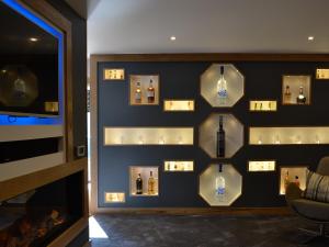 a wall with bottles of perfume on it at Hillend Stables in Dalry