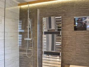 a shower stall in a bathroom with a shower at Hillend Stables in Dalry +21 photos