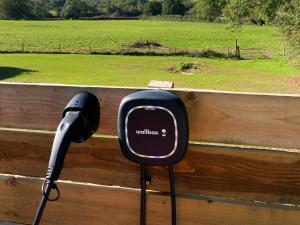 a hair dryer is attached to a wooden fence at Quabbs Head Cottage in Mathon