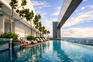 a swimming pool on the roof of a building at Royce Residence KLCC by Dormeo Destinations in Kuala Lumpur