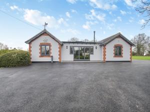 a large white church with a parking lot at Walcot House Stables in Diss +17 photos