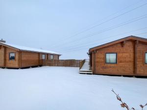 a couple of buildings with snow on the ground at Stag Lodge - Uk46921 in Falkirk