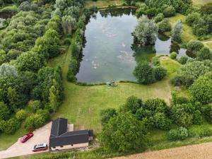 an aerial view of a house and a lake at Stillwater in Rockland Saint Peter +16 photos