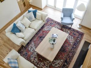 a living room with a couch and a table at The Stables - Uk11108 in Montrose +12 photos