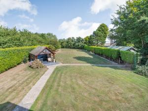 a garden with a gazebo and a hedge at The Hawthorns in Ottringham