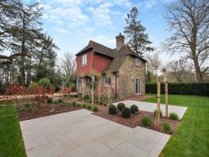 an old brick house with a red roof at Keeds Cottage in Pulborough
