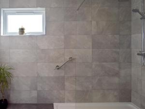 a bathroom with a shower with a tub at Willow Lodge - Uk13637 in Creetown +9 photos