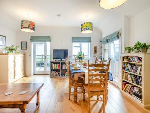 a dining room with a table and chairs at Larks Nest in Wortham