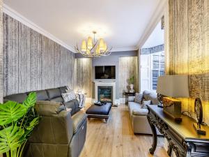 a living room with a couch and a fireplace at No3 On The Severn in Bridgnorth