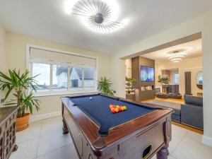 a living room with a pool table in it at Bryndedwydd in Borth