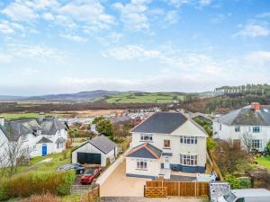 an aerial view of a large white house at Bryndedwydd in Borth