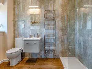 a bathroom with a toilet and a sink and a shower at Old Barn 2 - Uk48478 in Ferndown