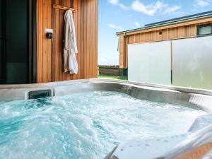 a jacuzzi tub in front of a building at Rue - Uk51100 in Clitheroe +8 photos