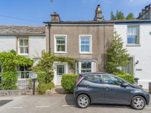a small car parked in front of a house at Barngarth in Cartmel