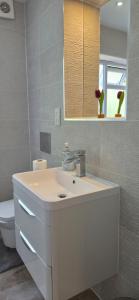 a bathroom with a sink and a toilet at Cozy 2BR apartment in Maidenhead Sleeps 6 in Maidenhead +42 photos