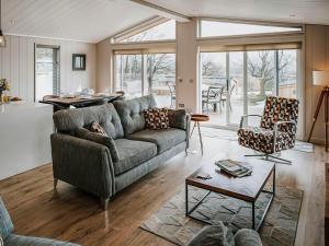 a living room with a couch and a table at Elmore - Uk51111 in Clitheroe