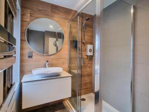 a bathroom with a sink and a mirror at Uk47853 - No 2B in Aberystwyth