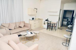 a living room with a couch and a table at روعة نجد القدس in Riyadh