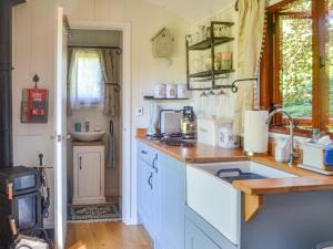 a kitchen with a sink and a counter top at Herdwick Hut Mountain Retreat in Twyn Llanan