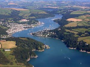 an aerial view of a river with boats in it at Meadow Barn - Blackdown Farm in Blackawton