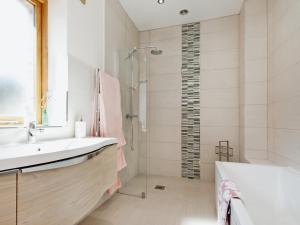 a bathroom with a shower and a sink and a tub at Meadow Barn - Blackdown Farm in Blackawton