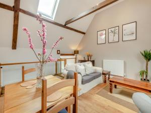 a living room with a couch and a table at The Cartlodge - Ukc1039 in Hickling