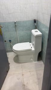 a bathroom with a toilet in a bathroom stall at شقق وردة الخرج in Al Kharj