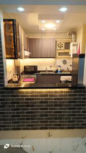 a kitchen with a brick counter top in a kitchen at Ashraf Residential Complex in Luxor