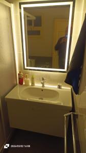 a person taking a picture of a bathroom sink at Ashraf Residential Complex in Luxor +16 photos