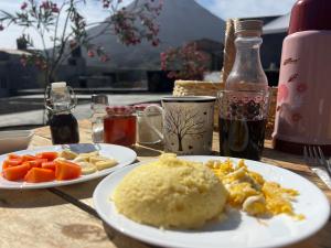 a table with two plates of food on it at EcoFunco in Portela +113 photos