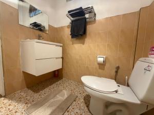 a bathroom with a toilet and a mirror at Siam phangan in Ko Phangan +39 photos