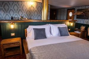 a bedroom with a large bed in a room at Piroscafo Lombardia in Arona