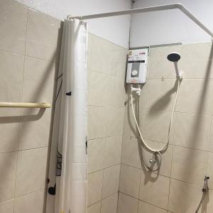 a shower in a bathroom with a shower curtain at Good Villa by Saran in Krabi +43 photos