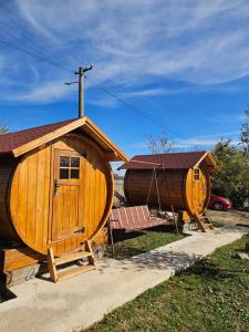 a large wooden house and a boat on display at Kucica in Lukavac +6 photos