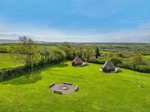 an aerial view of a field with two tents at Moor View Cabin (Oak Tree Lane) in Okehampton