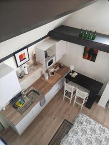 an overhead view of a kitchen with a table and chairs at Huma2025 in Eede