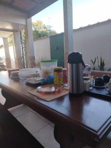 a table with a coffee maker on top of it at Pousada Consulado in Brasília
