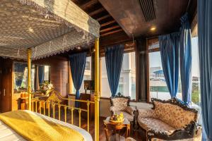 a living room with a bed and a couch at Le Dupleix in Pondicherry +74 photos