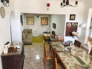 a living room with a table and a couch at mithwood in Nuwara Eliya
