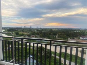 a view of a city from a balcony at Riverfront Homestay at Ambience Residence in Malacca