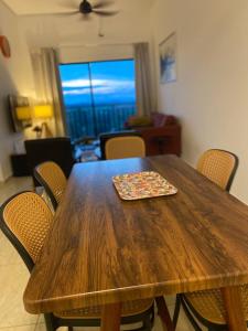 a wooden table with a tray on top of it at Riverfront Homestay at Ambience Residence in Malacca