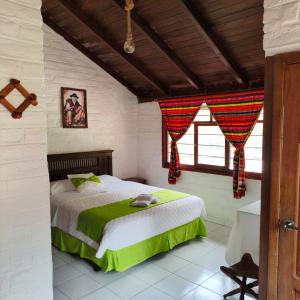 a bedroom with a large bed in a room at Hostería Agoyán Deluxe in Ulba +39 photos
