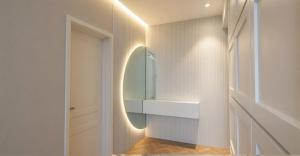 a bathroom with a refrigerator and a walk in closet at The Central Stay Cagliari in Cagliari