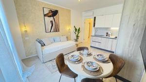 a living room with a table and chairs and a couch at Dimora degli Ulivi in Bagnaia